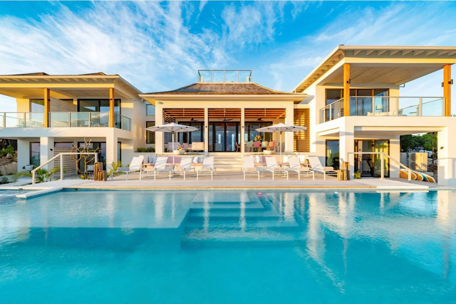 Large pool in front of a contemporary villa with wide terraces at Bristol Breeze, Providenciales