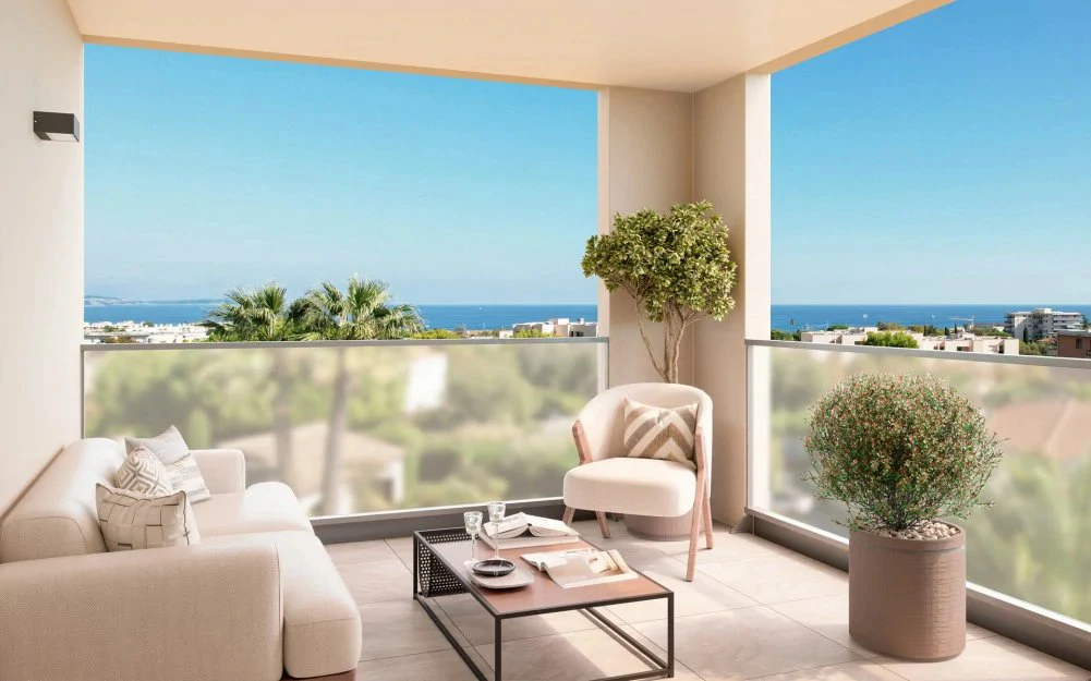 Rendering of a furnished covered terrace at Floréa Parc in Antibes looking over palm trees to the Mediterranean