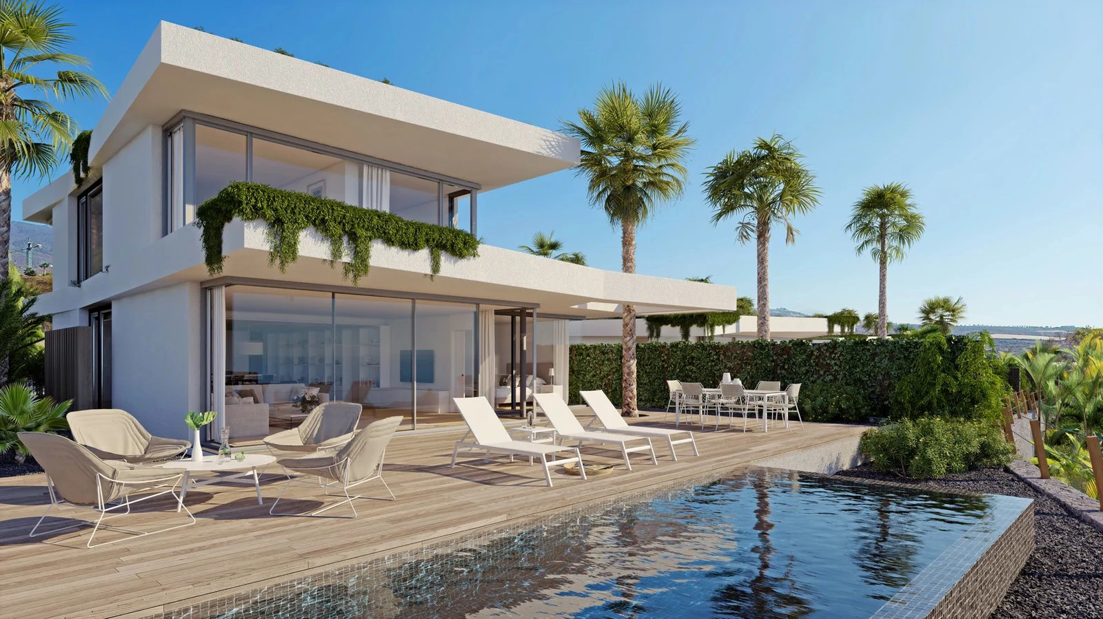 A modern white villa with a private pool, terrace loungers and palm trees under a blue sky at Abama Resort, Tenerife