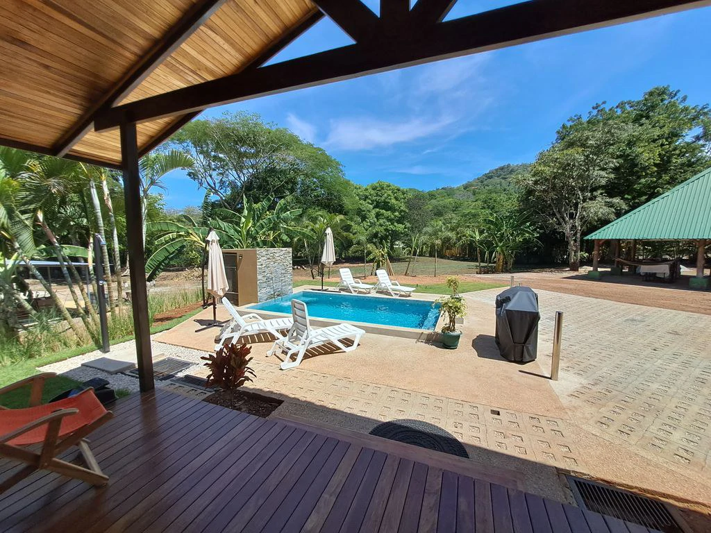 Compound Cooper: Compound Cooper includes Casa Cooper - a Newly constructed in 2023 - 2 Bedroom 1 Bath home set on a spacious 703 m2 lot and Lote Cooper which is 2485 m2 of flat buildable land - both - Gallery image 2