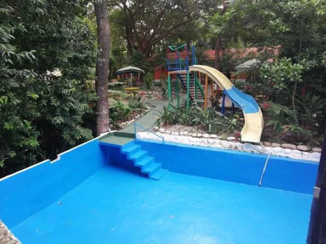 Hotspring Resort for sale in Salitral, Cold and Warm spring swimming pools surrounded by teak and eucalyptus rustic cabins