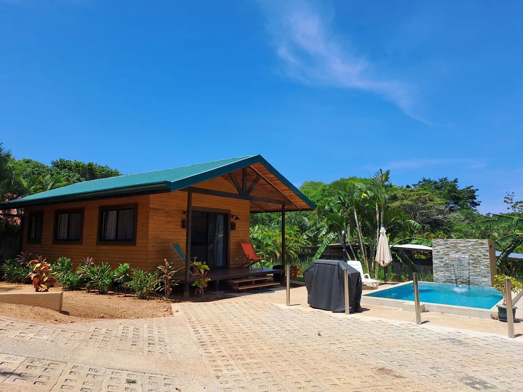 Compound Cooper: Compound Cooper includes Casa Cooper - a Newly constructed in 2023 - 2 Bedroom 1 Bath home set on a spacious 703 m2 lot and Lote Cooper which is 2485 m2 of flat buildable land - both