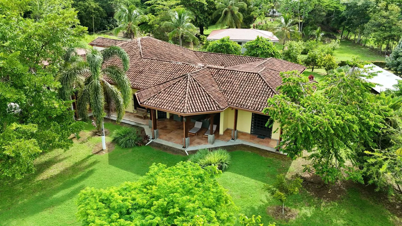 Tropical Luxury Estate with Private Lake, Pool & Prime Location Near Costa Rica’s Best Beaches: Near the Coast House For Sale in Parrita