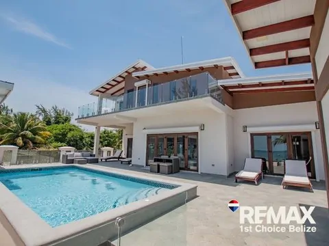 Own Your Slice of Paradise in This Beach Front Home